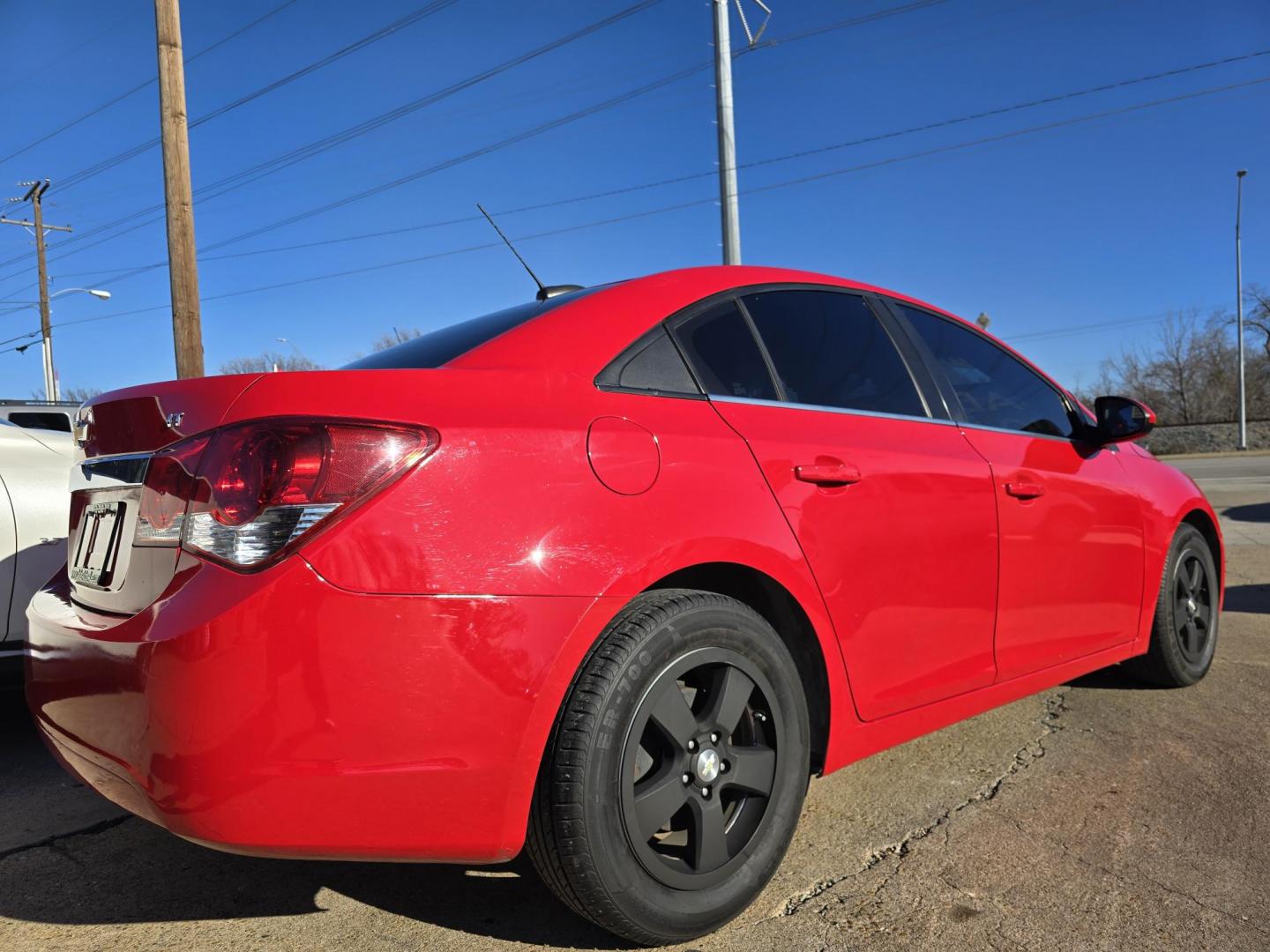 2015 RED /BLACK Chevrolet Cruze 1LT (1G1PC5SB0F7) with an 1.4L L4 DOHC 16V TURBO engine, 6-Speed Automatic transmission, located at 2660 S.Garland Avenue, Garland, TX, 75041, (469) 298-3118, 32.885551, -96.655602 - Welcome to DallasAutos4Less, one of the Premier BUY HERE PAY HERE Dealers in the North Dallas Area. We specialize in financing to people with NO CREDIT or BAD CREDIT. We need proof of income, proof of residence, and a ID. Come buy your new car from us today!! This is a very well cared for 2015 CH - Photo#3