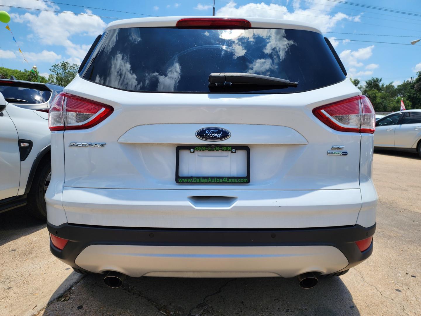 2016 WHITE Ford Escape SE (1FMCU9GX0GU) with an 1.6L L4 DOHC 16V engine, 6-Speed Automatic transmission, located at 2660 S.Garland Avenue, Garland, TX, 75041, (469) 298-3118, 32.885551, -96.655602 - Welcome to DallasAutos4Less, one of the Premier BUY HERE PAY HERE Dealers in the North Dallas Area. We specialize in financing to people with NO CREDIT or BAD CREDIT. We need proof of income, proof of residence, and a ID. Come buy your new car from us today!! This is a Super Clean 2016 FORD ESCAP - Photo#4